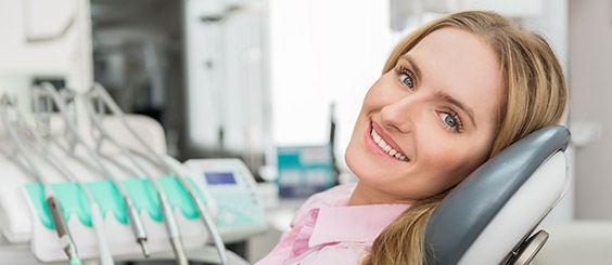 Smiling woman relaxing in dental chair